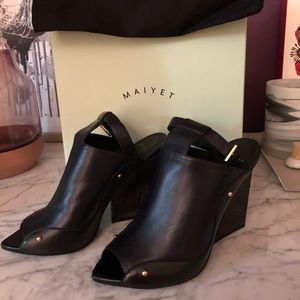 Navy Blue Leather Maiyet shoes with wedge heel.